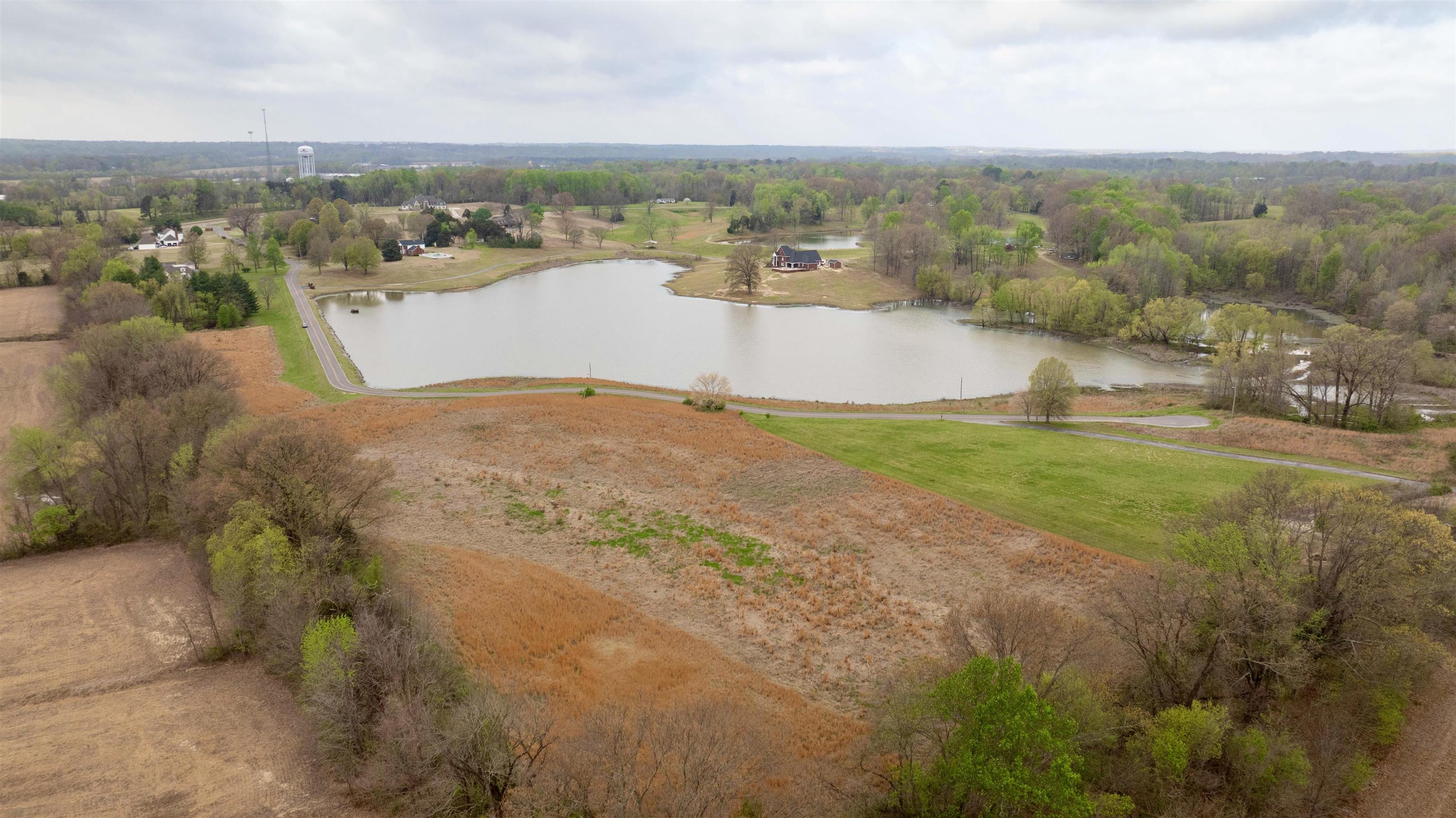 0 Hunters Trace Drive Ripley, TN 38063 - Photo 6 of 33 an aerial view of a houses with a yard and lake view