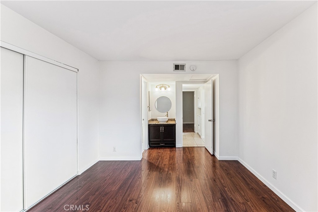999 West Pine Street, Unit D Upland, CA 91786 - Photo 11 of 16 an entryway at a room with wooden floor