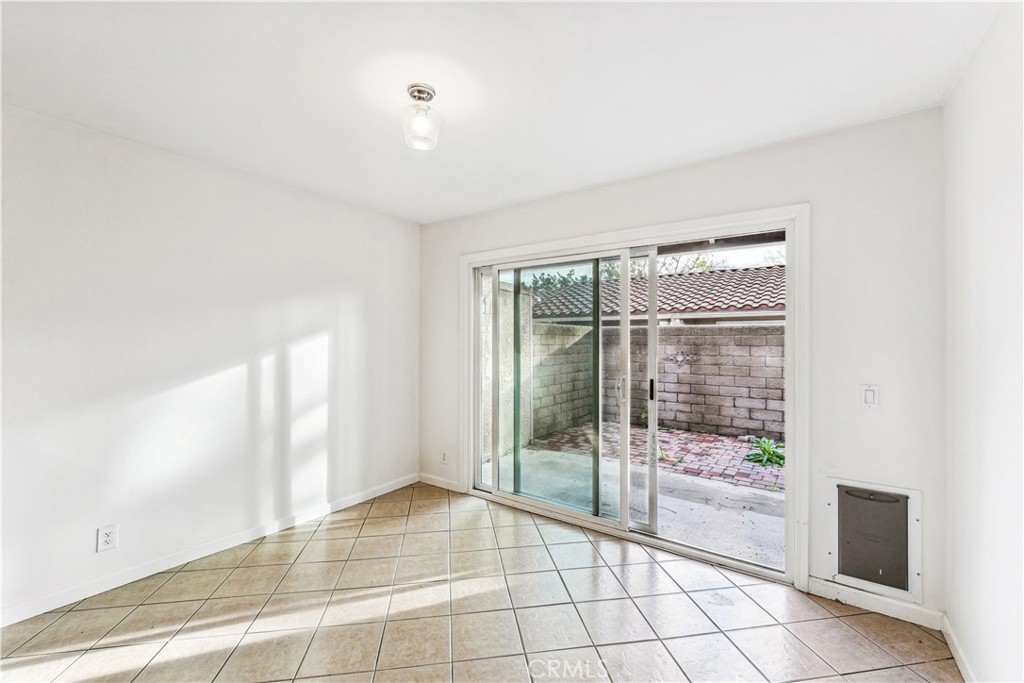 999 West Pine Street, Unit D Upland, CA 91786 - Photo 12 of 16 a view of an empty room and window