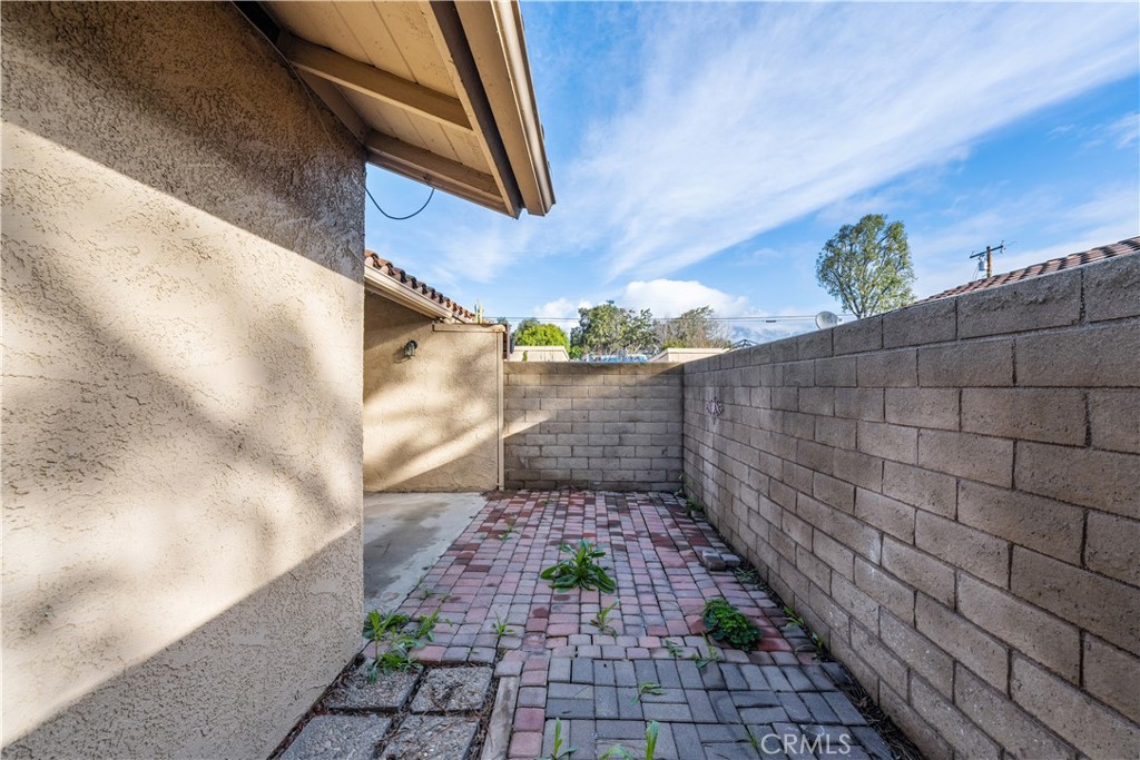 999 West Pine Street, Unit D Upland, CA 91786 - Photo 14 of 16 a view of a pathway both side of building