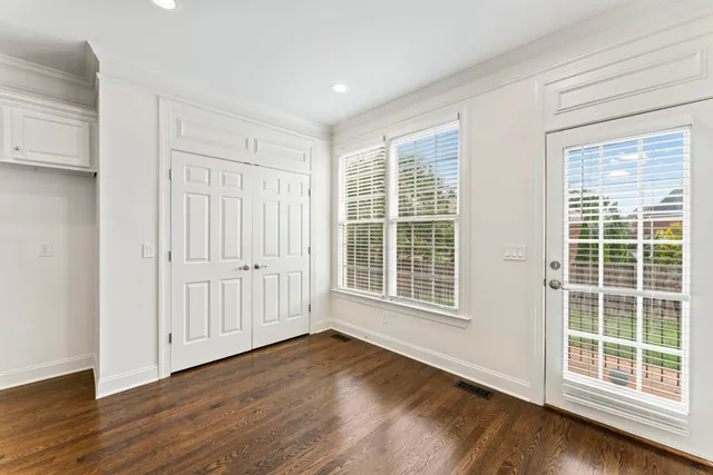 a view of an entryway with wooden floor
