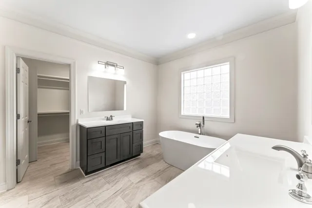 a view of walk in closet with empty racks