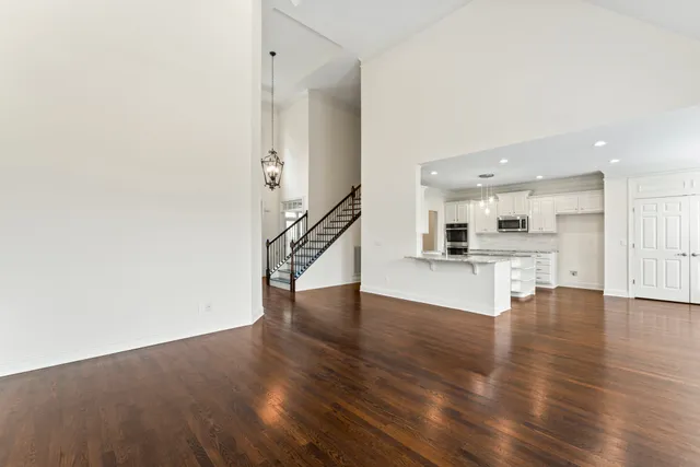 a view of kitchen with wooden floor and a sink