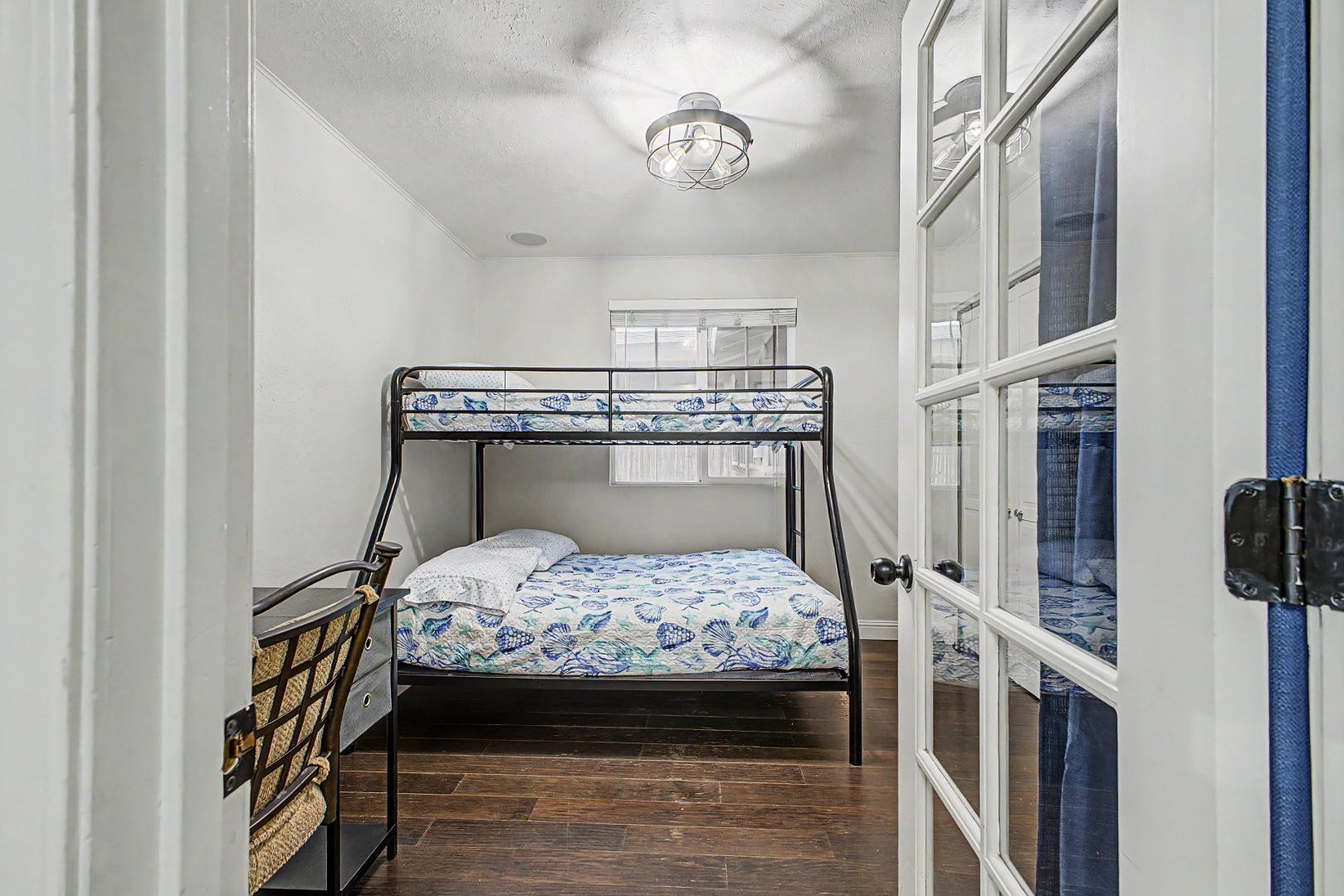 3346 East Cochise Road Phoenix, AZ 85028 - Photo 32 of 40 a bedroom with a bed and a chandelier