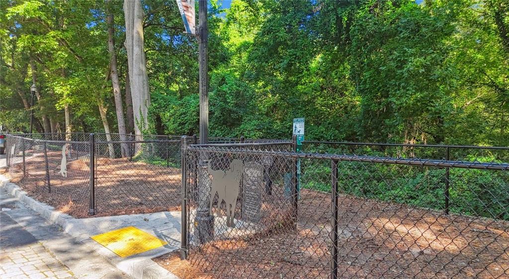 2910 Clairmont Road, Unit PLAN 1 Atlanta, GA 30329 - Photo 19 of 29 a view of a backyard with fence