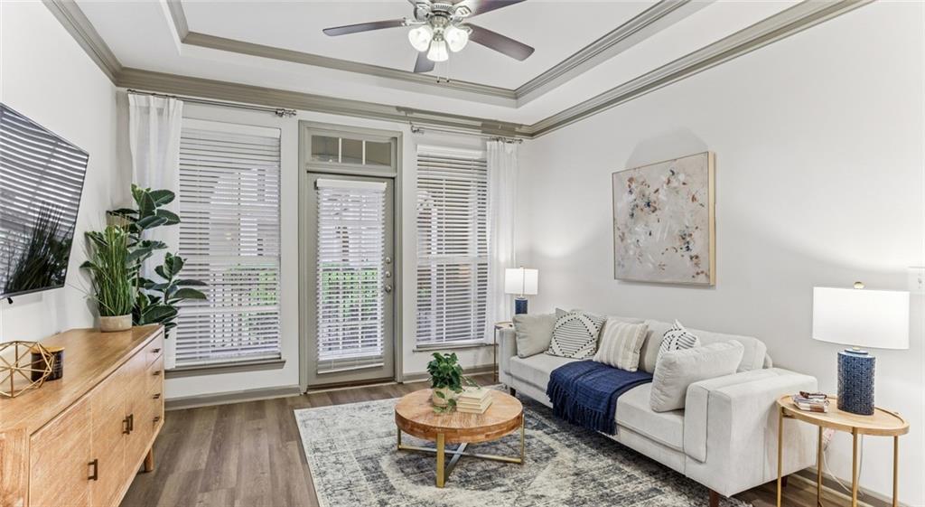 2910 Clairmont Road, Unit PLAN 1 Atlanta, GA 30329 - Photo 24 of 29 a living room with furniture and a large window