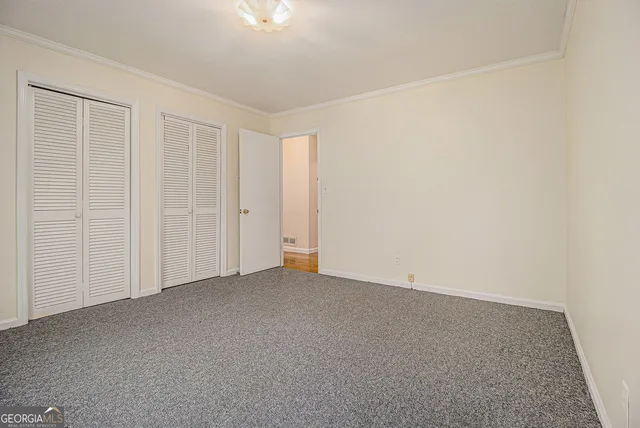 an empty room with a empty space and a window