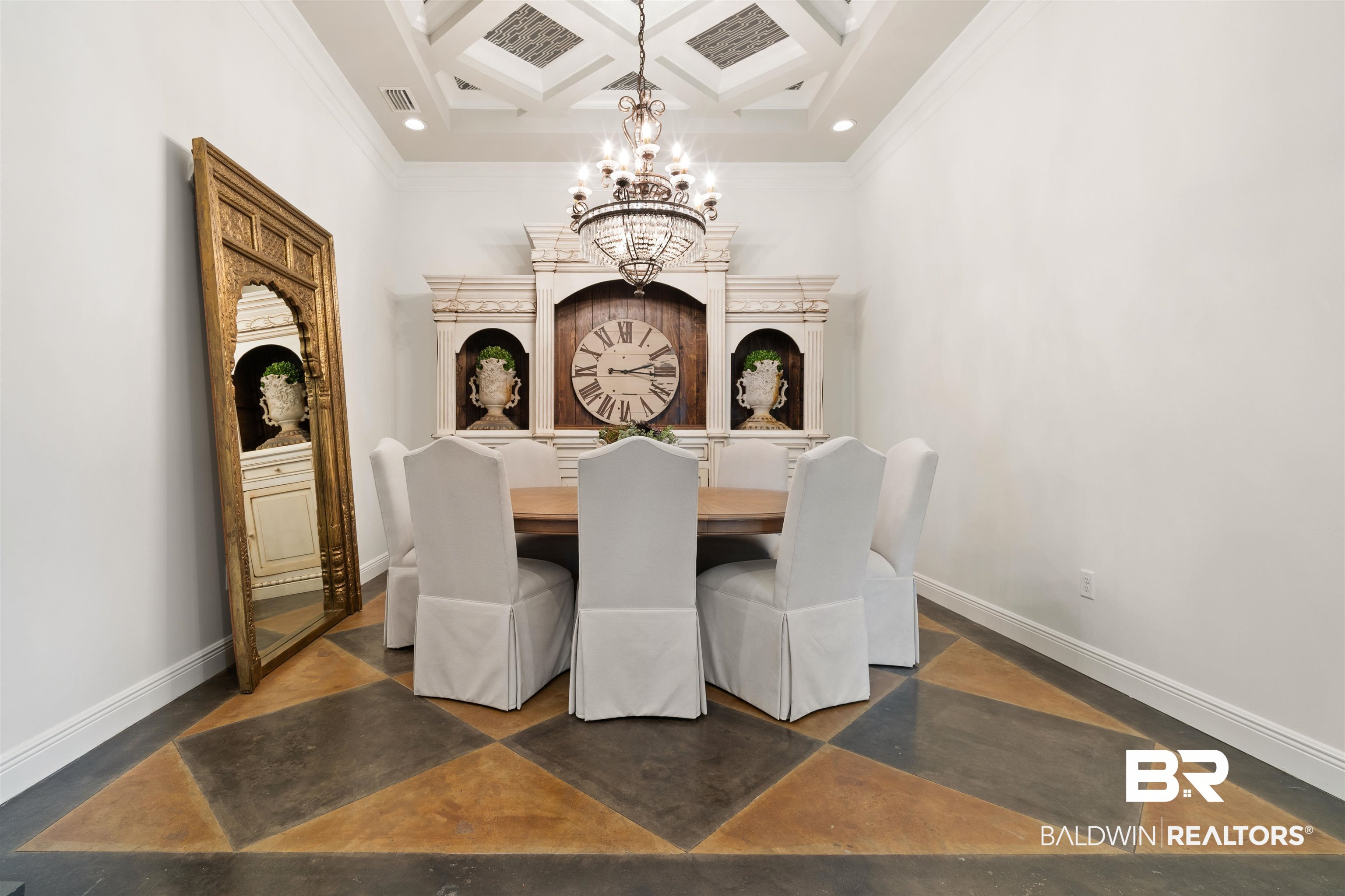 3584 Rue Royal Mobile, AL 36693 - Photo 14 of 35 Dining room with a chandelier, baseboards, coffered ceiling, and finished concrete floors