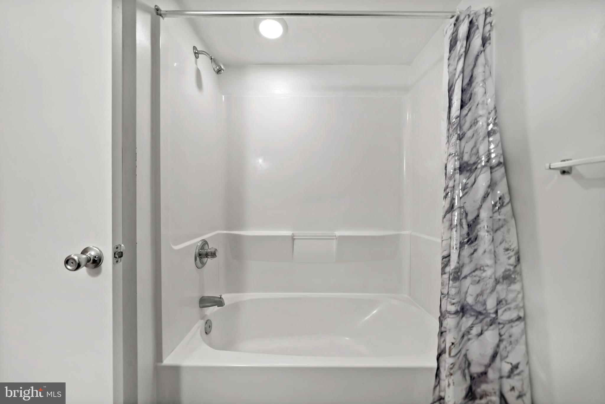 4041 Cresson Street Philadelphia, PA 19127 - Photo 17 of 32 a bathroom with a shower and a bathtub