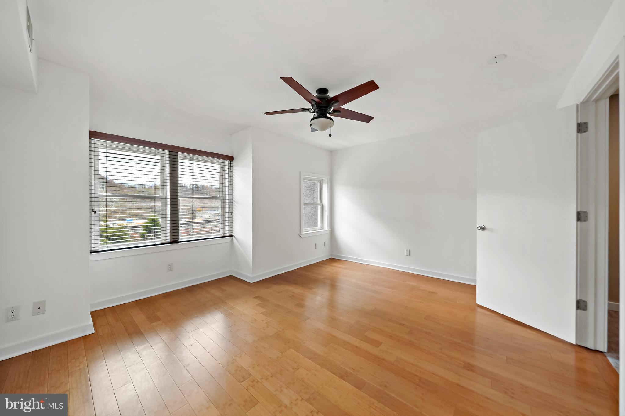 4041 Cresson Street Philadelphia, PA 19127 - Photo 18 of 32 an empty room with wooden floor and windows