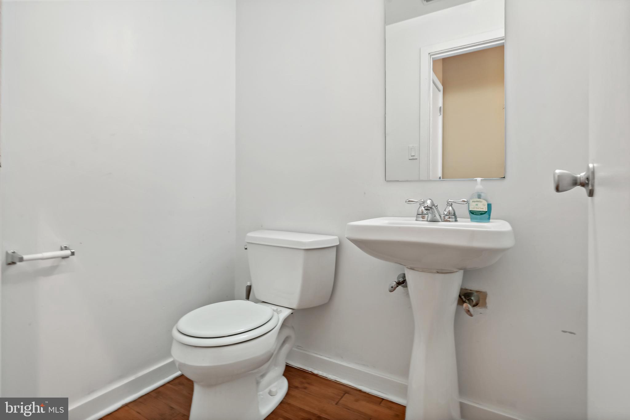 4041 Cresson Street Philadelphia, PA 19127 - Photo 2 of 32 a bathroom with a sink toilet and a mirror