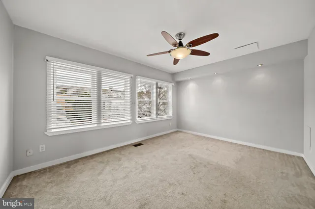 a bathroom with a shower sink and mirror