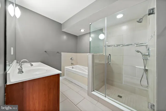 a bathroom with a glass shower door