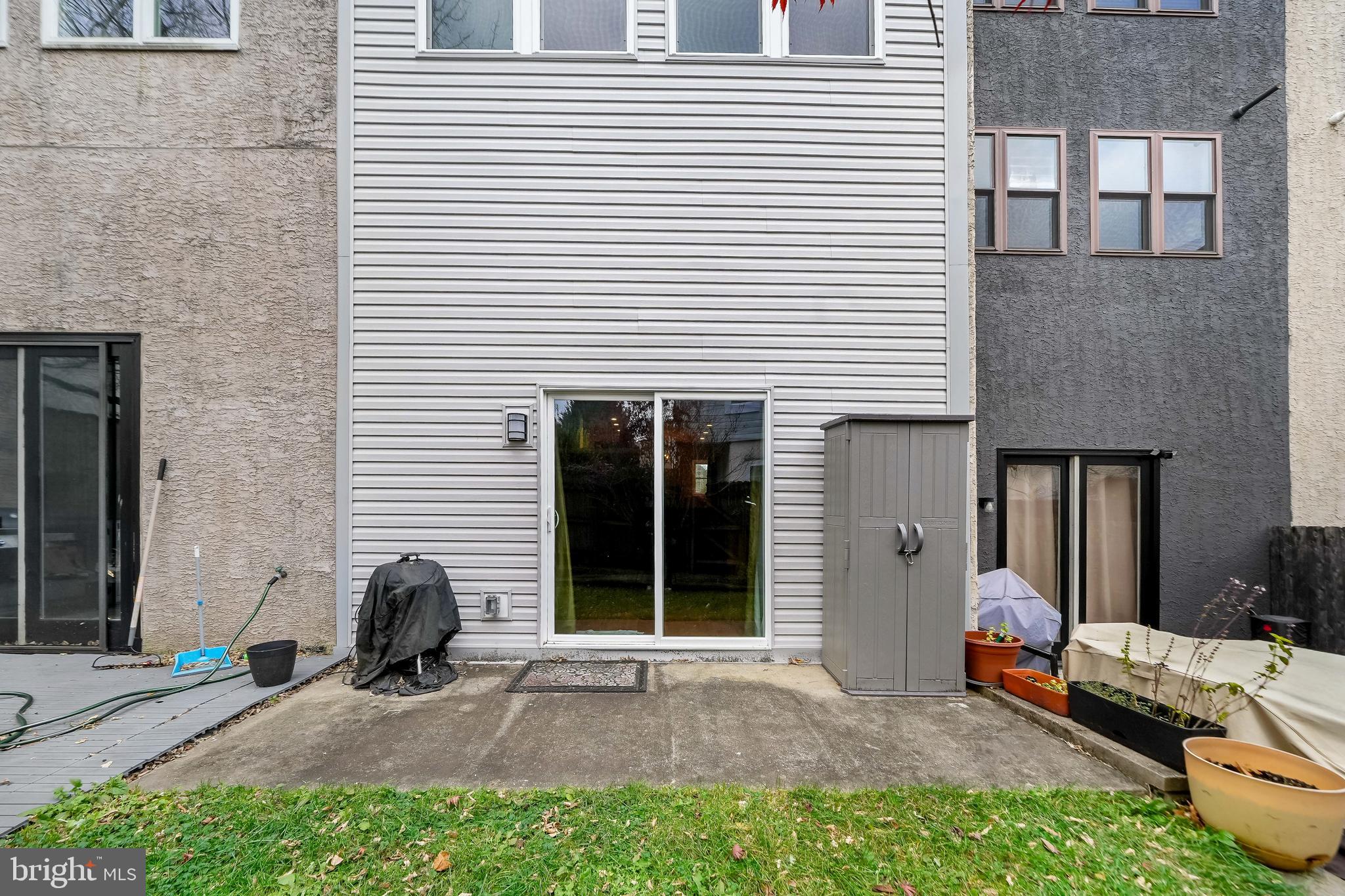 4041 Cresson Street Philadelphia, PA 19127 - Photo 31 of 32 a backyard of a house with barbeque oven table and chairs