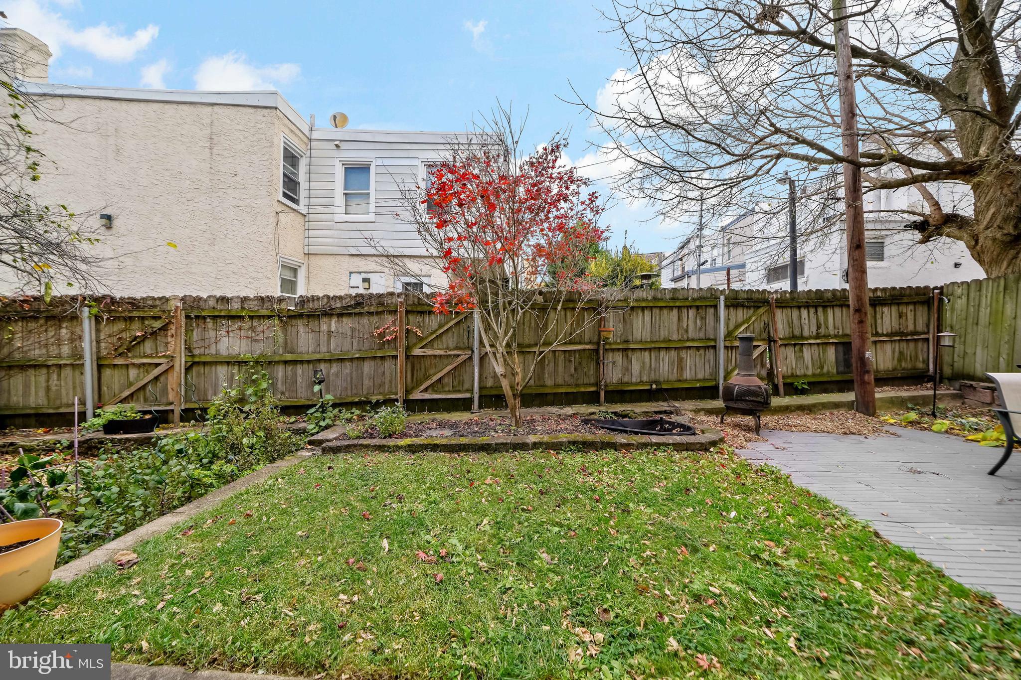 4041 Cresson Street Philadelphia, PA 19127 - Photo 32 of 32 a view of a backyard with plants and a bench