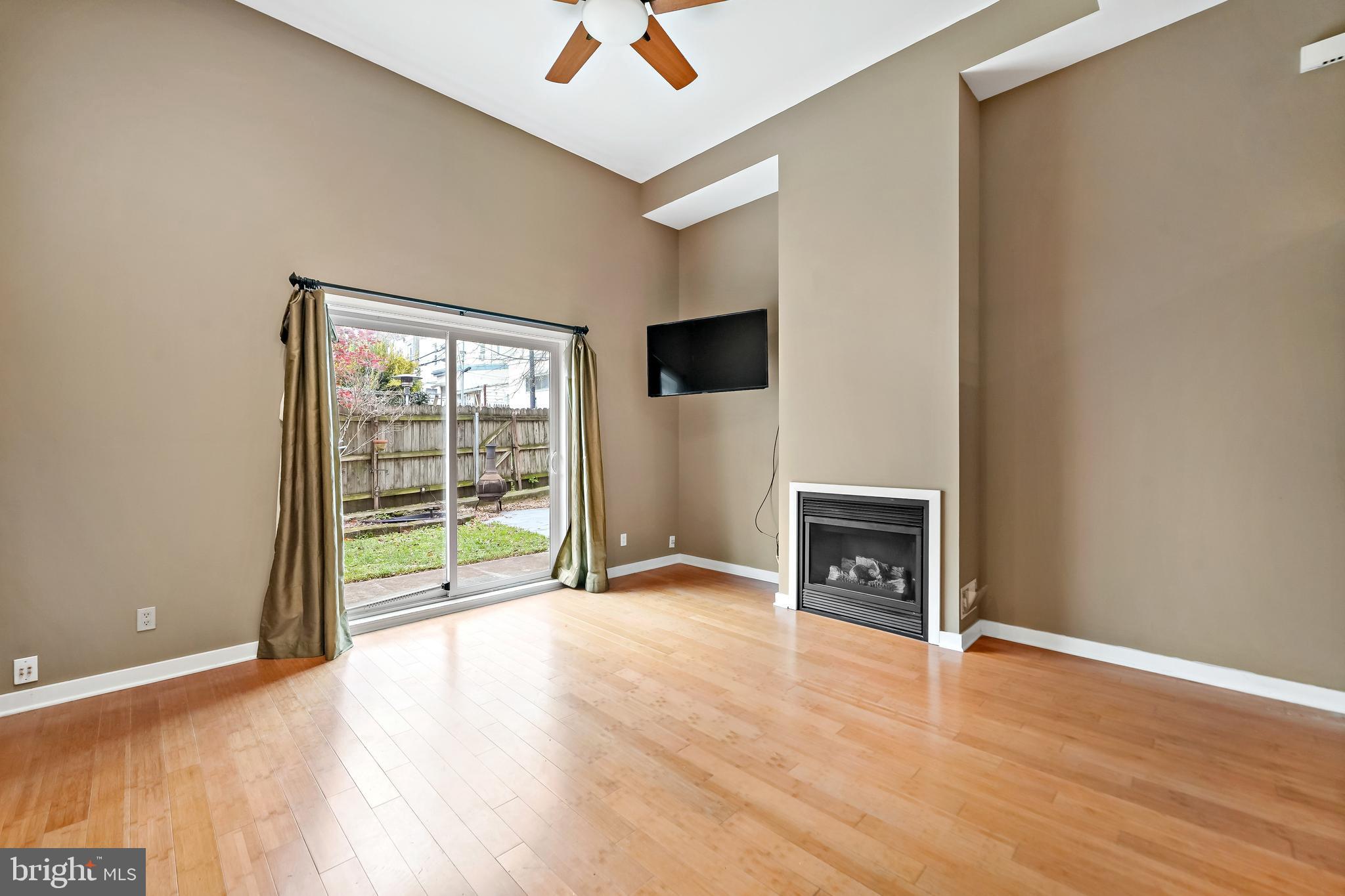 4041 Cresson Street Philadelphia, PA 19127 - Photo 4 of 32 a view of an empty room with a fireplace and a window