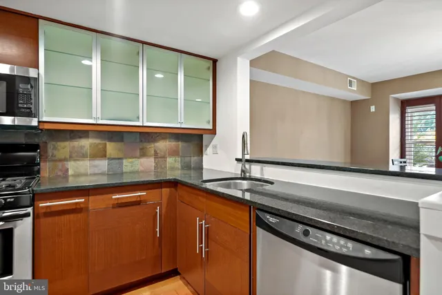 a kitchen with a sink and a window