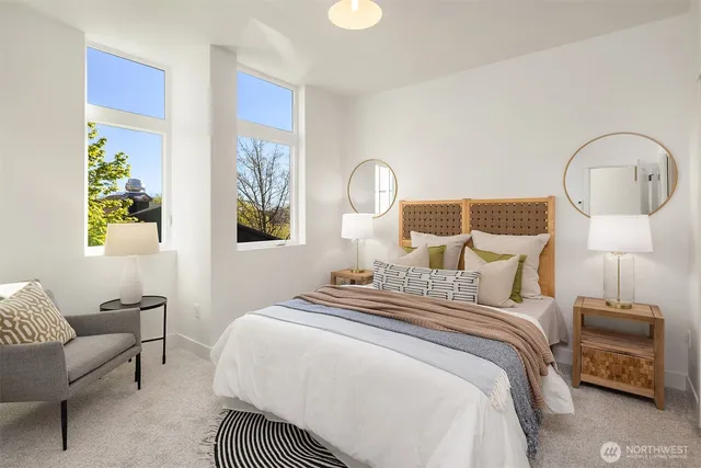 a bedroom with a bed and a lamp