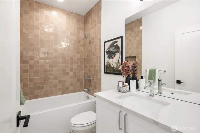 a bathroom with a sink a toilet and a bathtub