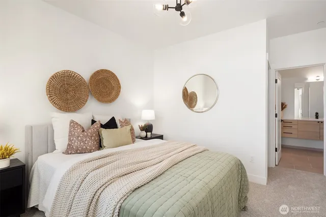 a bedroom with bed and a chandelier