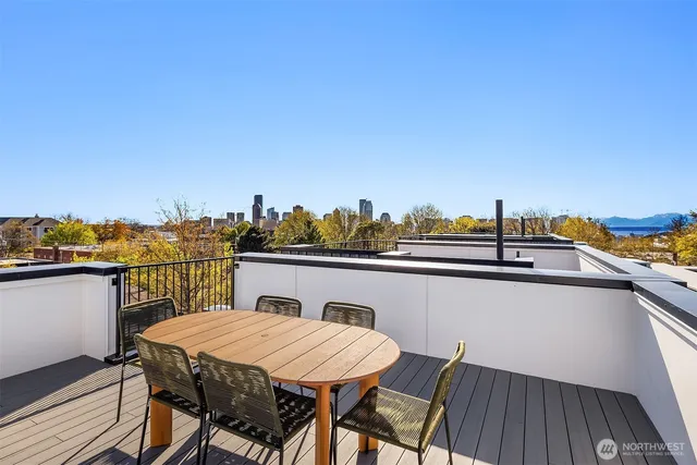 a terrace with a table and chairs