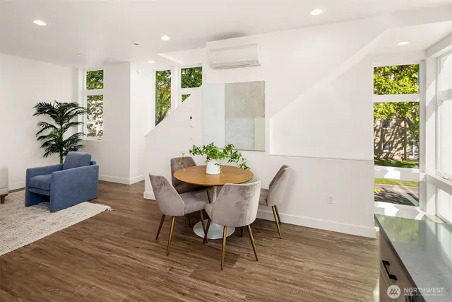 a view of a dining room with furniture window and wooden floor