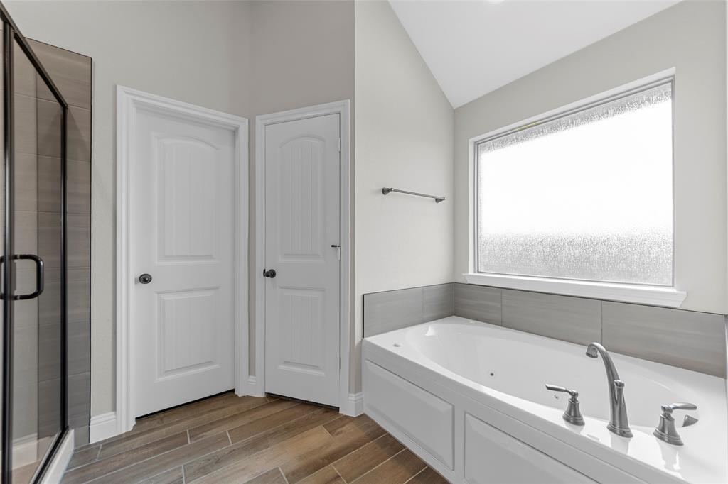 314 Pennington Road Josephine, TX 75173 - Photo 18 of 26 a bathroom with a tub shower and sink