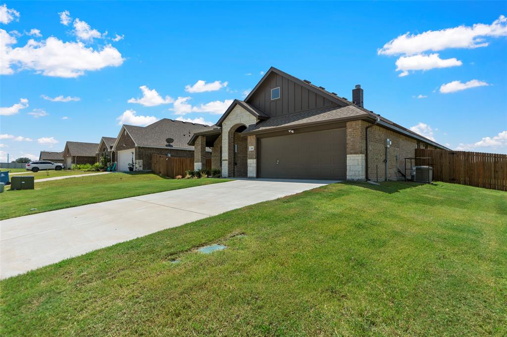 314 Pennington Road Josephine, TX 75173 - Photo 3 of 26 a view of a house with a big yard and large tree
