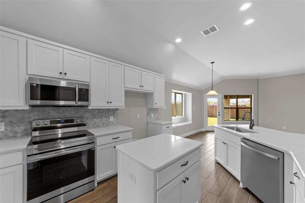314 Pennington Road Josephine, TX 75173 - Photo 9 of 26 a kitchen with a sink stove and microwave