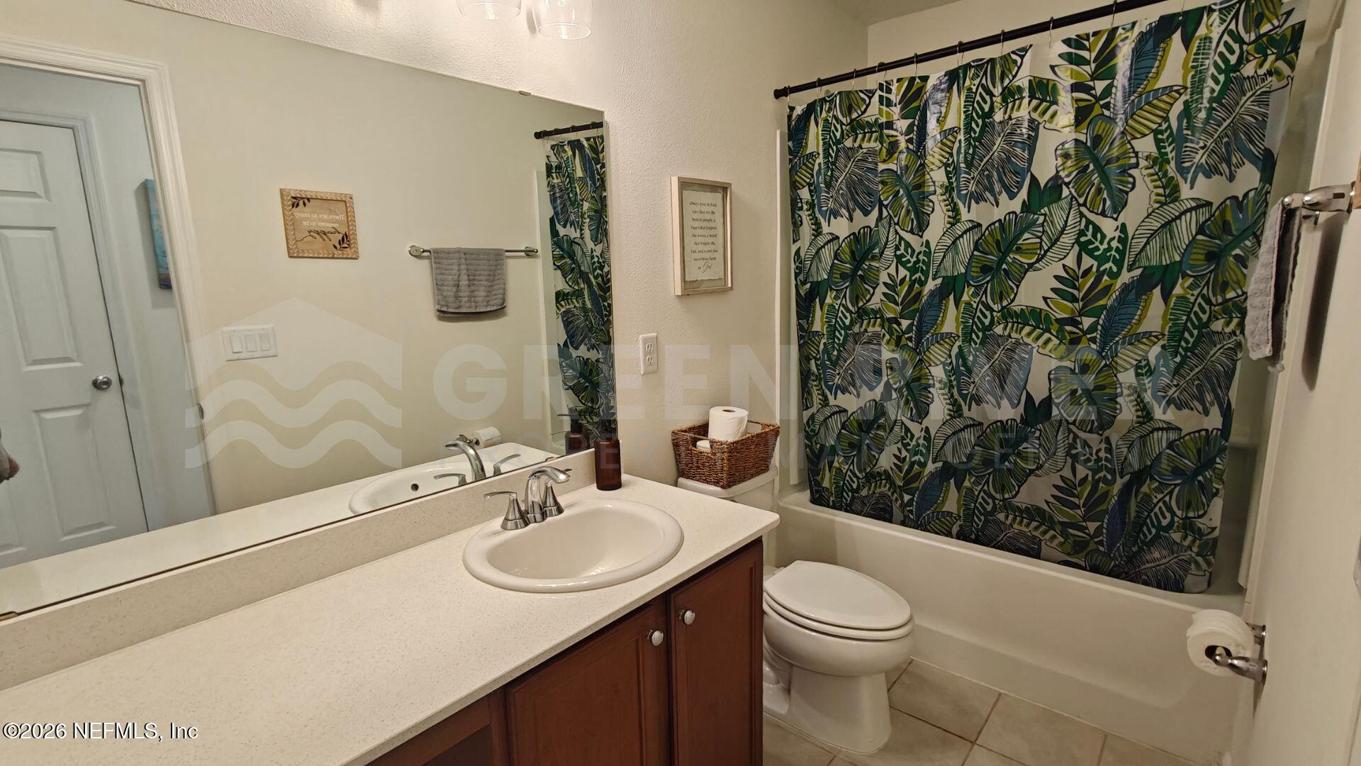 352 Rambling Brk Trail St. Johns, FL 32259 - Photo 20 of 35 a bathroom with a sink a toilet and shower
