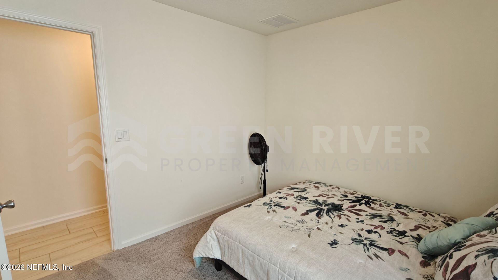 352 Rambling Brk Trail St. Johns, FL 32259 - Photo 24 of 35 a bedroom with a bed and a window