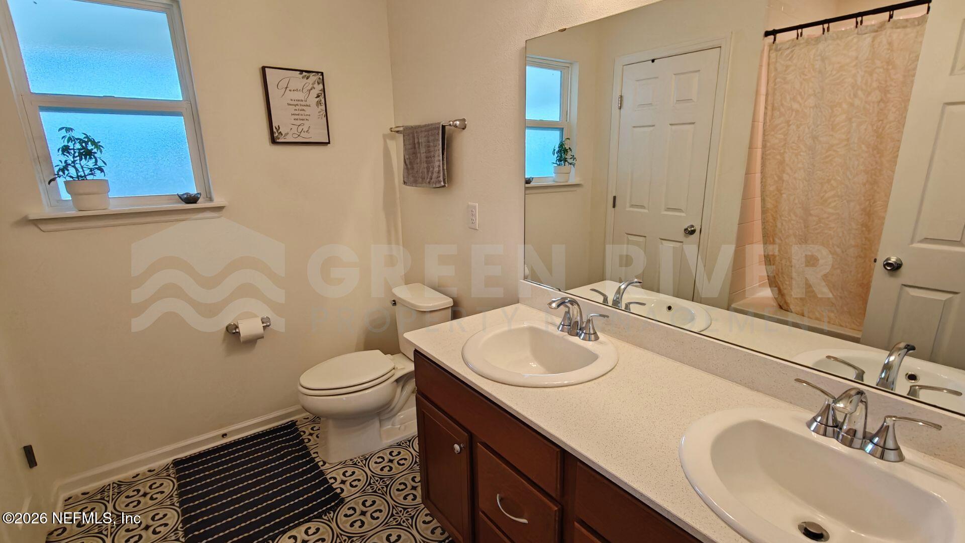 352 Rambling Brk Trail St. Johns, FL 32259 - Photo 26 of 35 a bathroom with a sink and a toilet