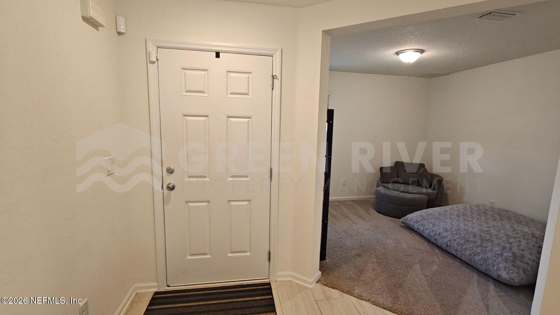 352 Rambling Brk Trail St. Johns, FL 32259 - Photo 6 of 35 a bedroom with a bed and a mirror