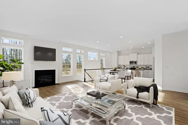 a living room with furniture fireplace and flat screen tv
