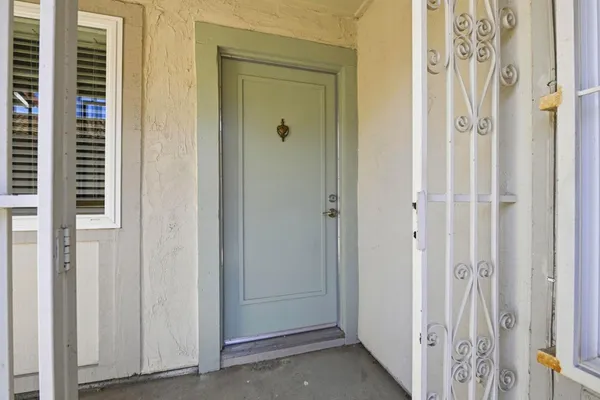 a view of a bathroom from the door