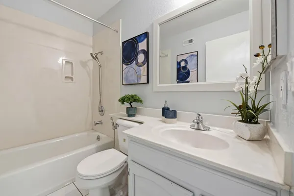 a bathroom with a sink toilet and a bathtub