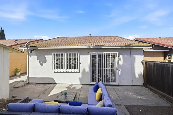 a backyard of a house with seating space