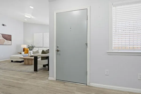 a bed room with furniture and a window