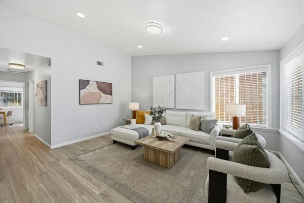 a living room with furniture and a window