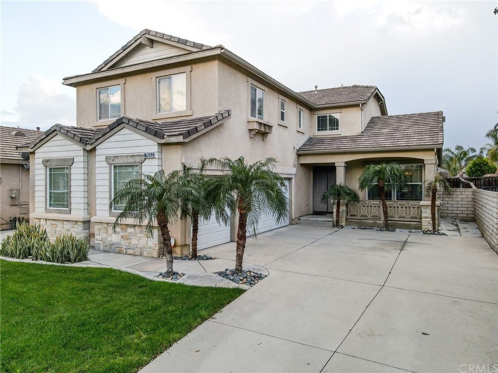 7652 Pinot Place Rancho Cucamonga, CA 91739 - Photo 1 of 1 a front view of a house with a garden