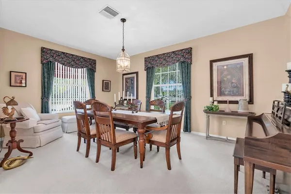 a view of a dining room with furniture window and outside view