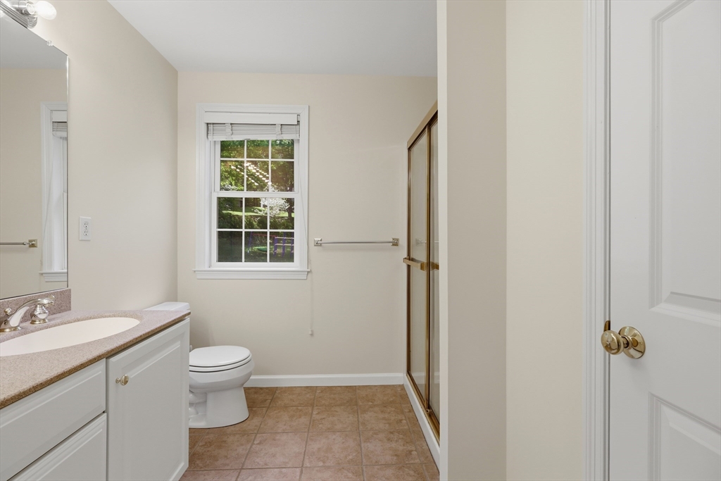 61 Indian Head Road Framingham, MA 01701 - Photo 30 of 42 a bathroom with a toilet sink and a mirror