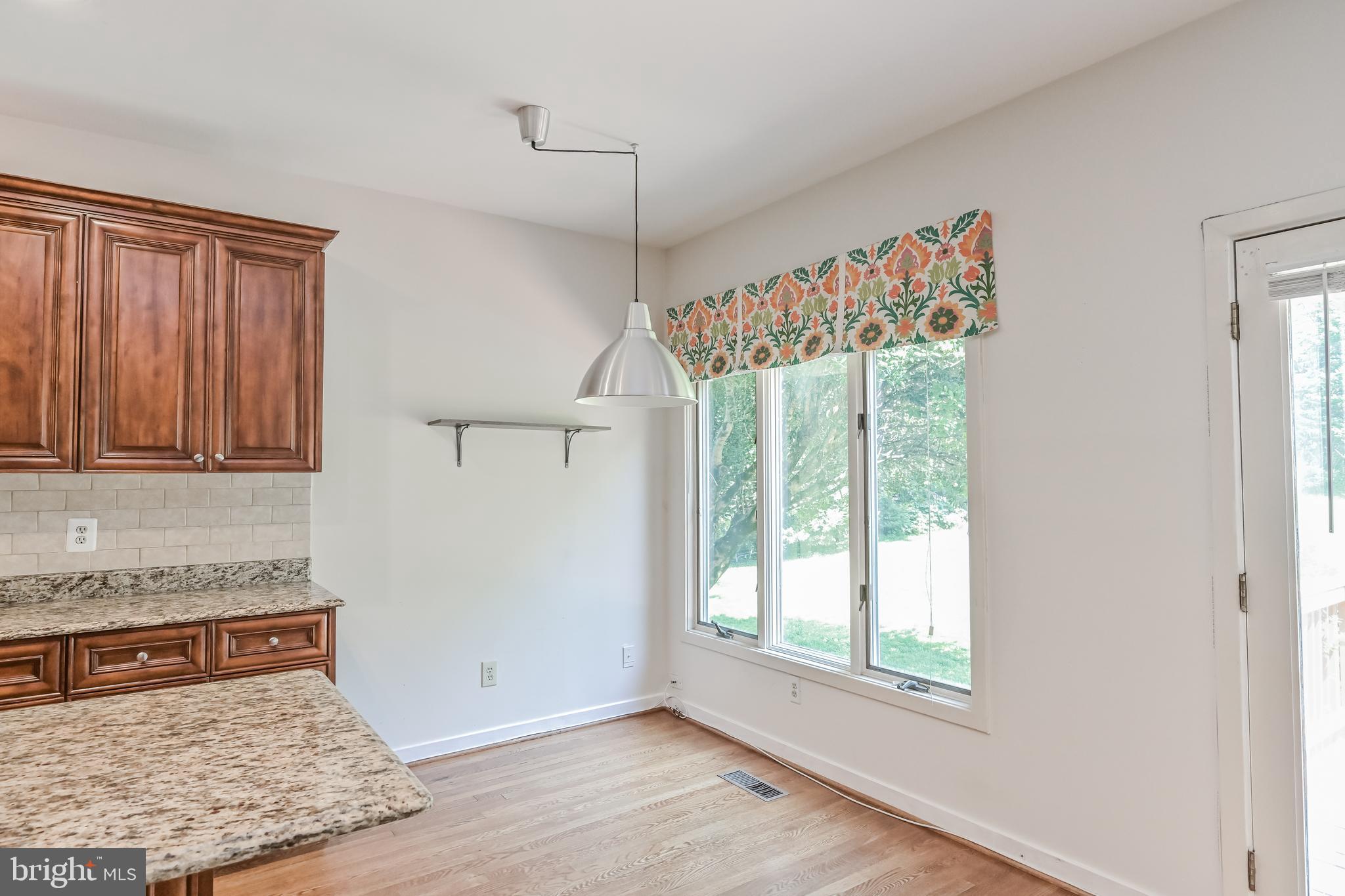 445 Springvale Road Great Falls, VA 22066 - Photo 14 of 62 a living room with a couch and a rug