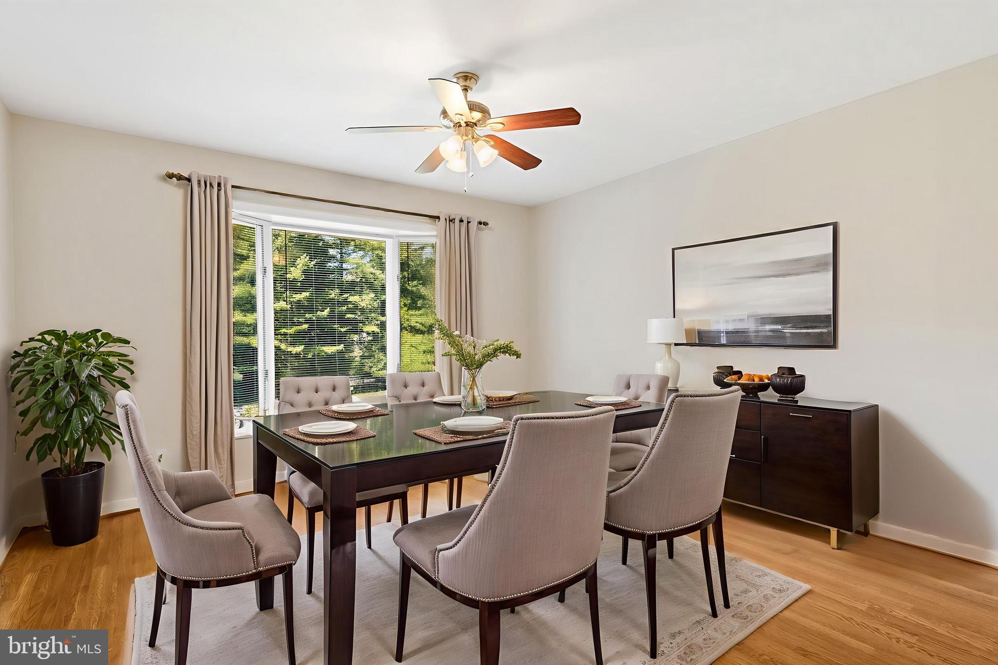 445 Springvale Road Great Falls, VA 22066 - Photo 19 of 62 a view of a dining room with furniture window and outside view