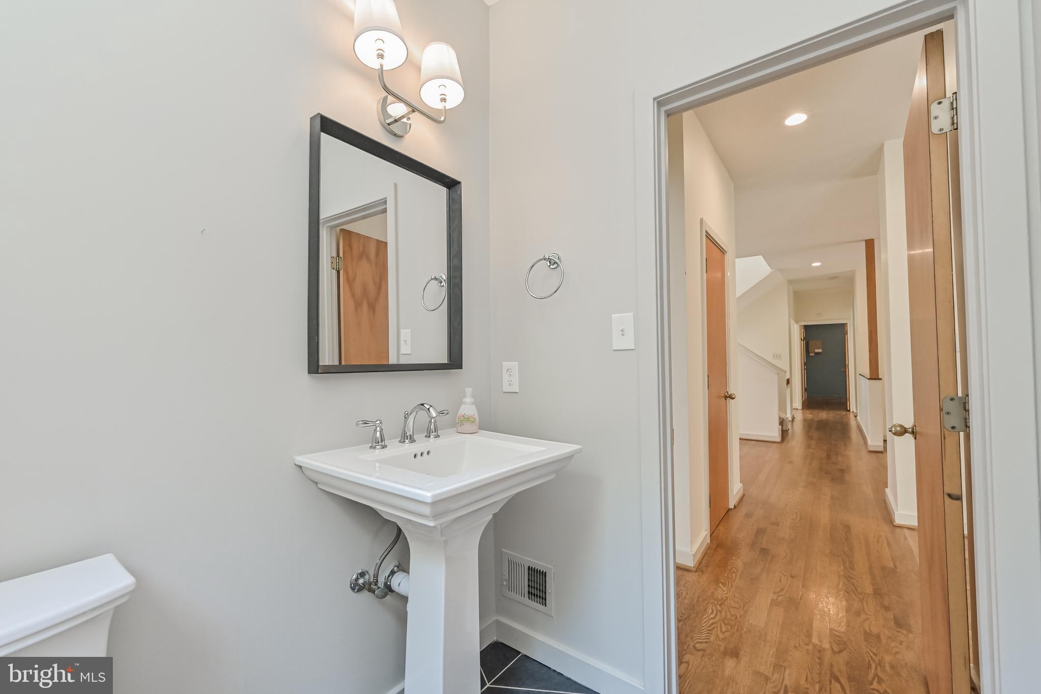 445 Springvale Road Great Falls, VA 22066 - Photo 21 of 62 a bathroom with a sink and a mirror