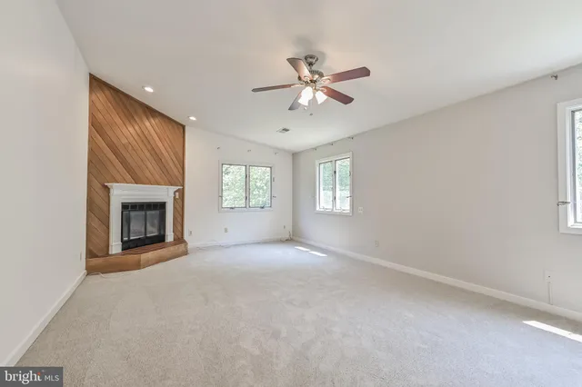 a spacious bathroom with double vanity a mirror a bathtub and a shower