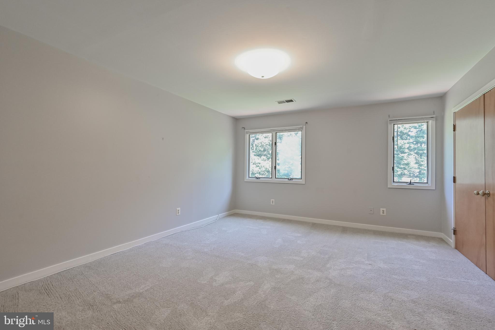 445 Springvale Road Great Falls, VA 22066 - Photo 32 of 62 an empty room with windows