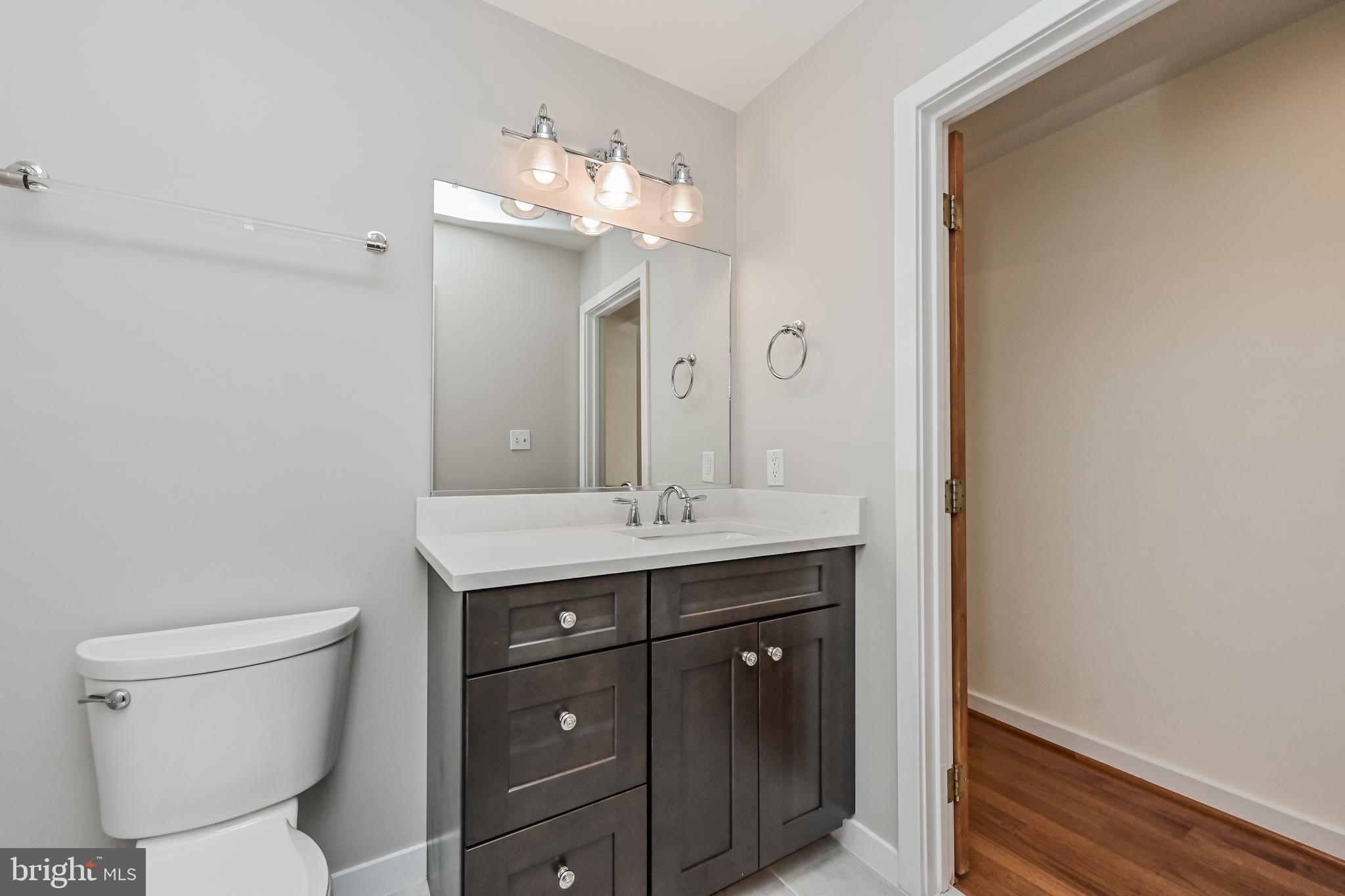 445 Springvale Road Great Falls, VA 22066 - Photo 35 of 62 Espresso Vanity with Quartz Countertops