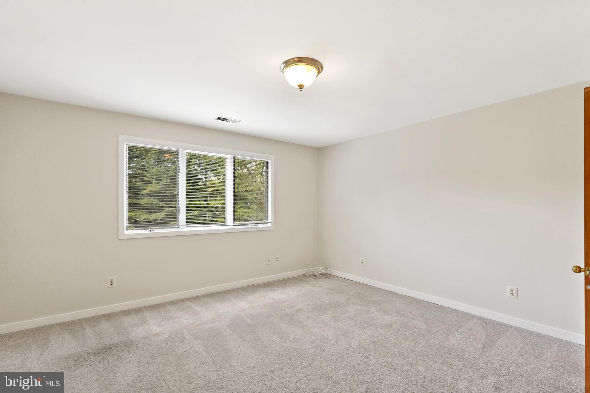 445 Springvale Road Great Falls, VA 22066 - Photo 36 of 62 an empty room with a window