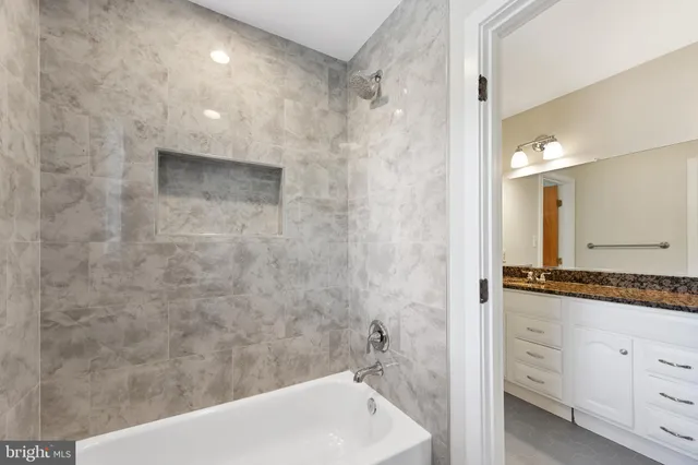 a view of a porch with a wooden fence